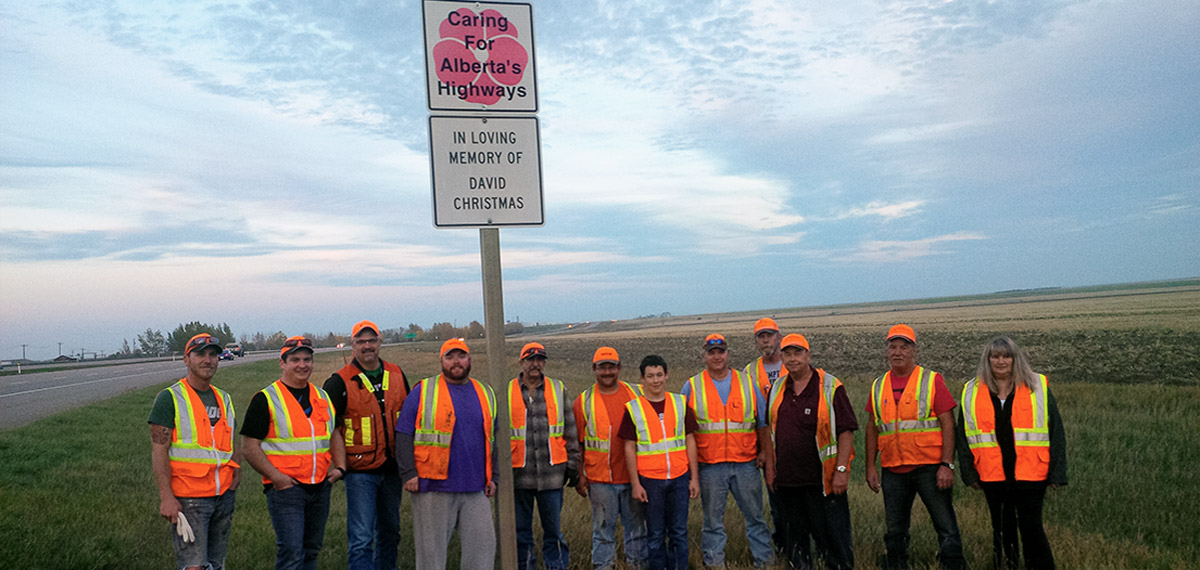 Volker Stevin Highways crew standing infront of a sign for In Loving Memory of David Christmas