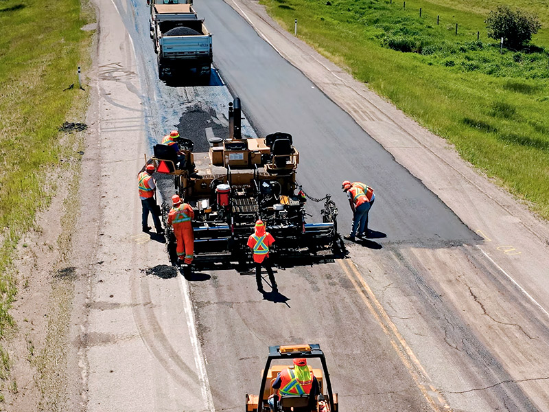 Paving crew road construction